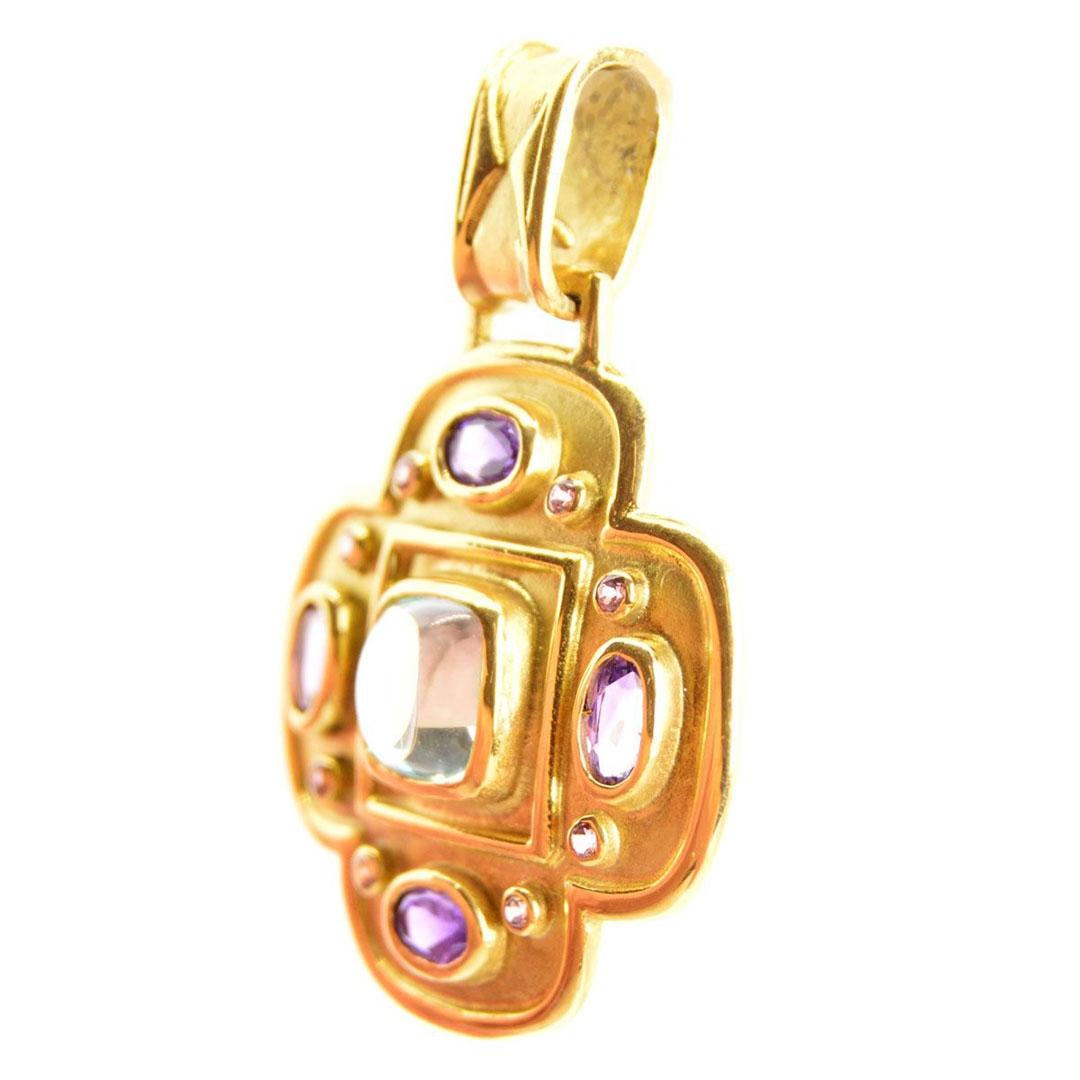 COLGANTE CRUZ ORO 18K CON PIEDRA LILA 11042